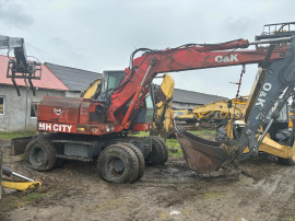 Dezmembrez excavator pe roti O&K OK MH CITY